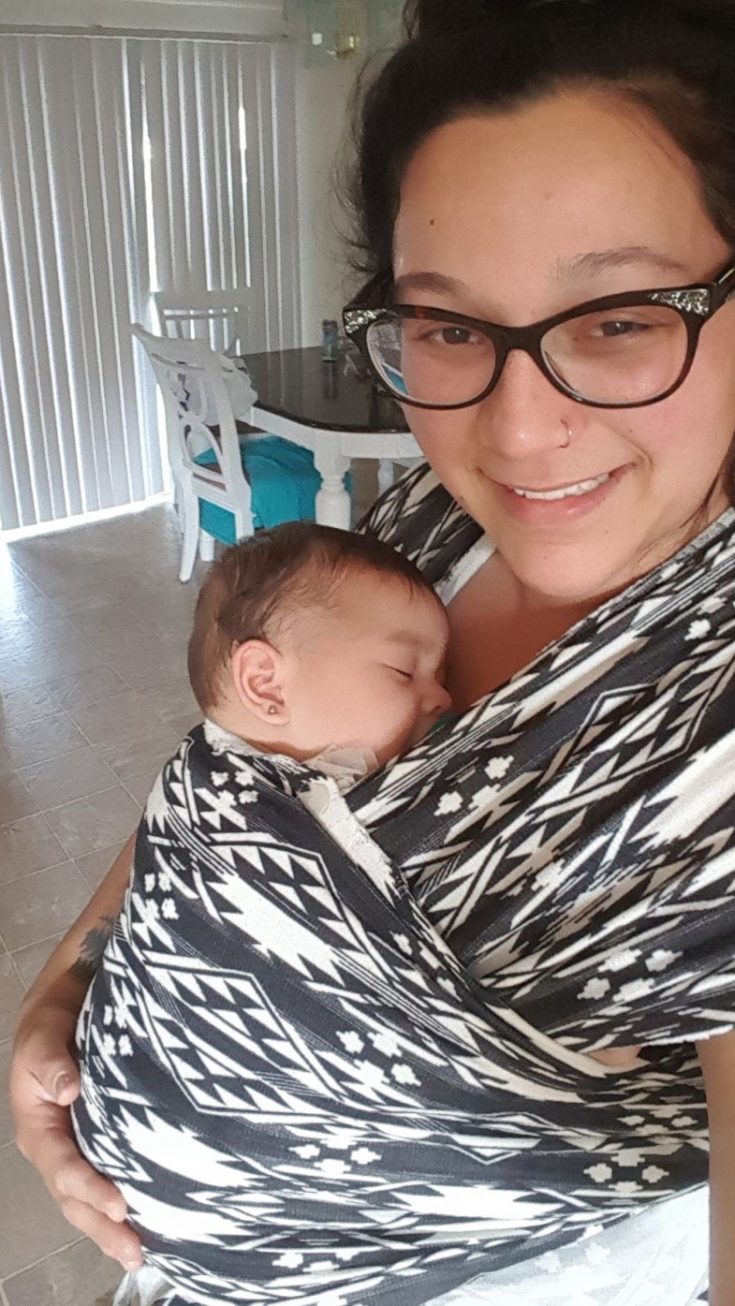 The Tattooed Momma using DIY baby wrap to carry infant