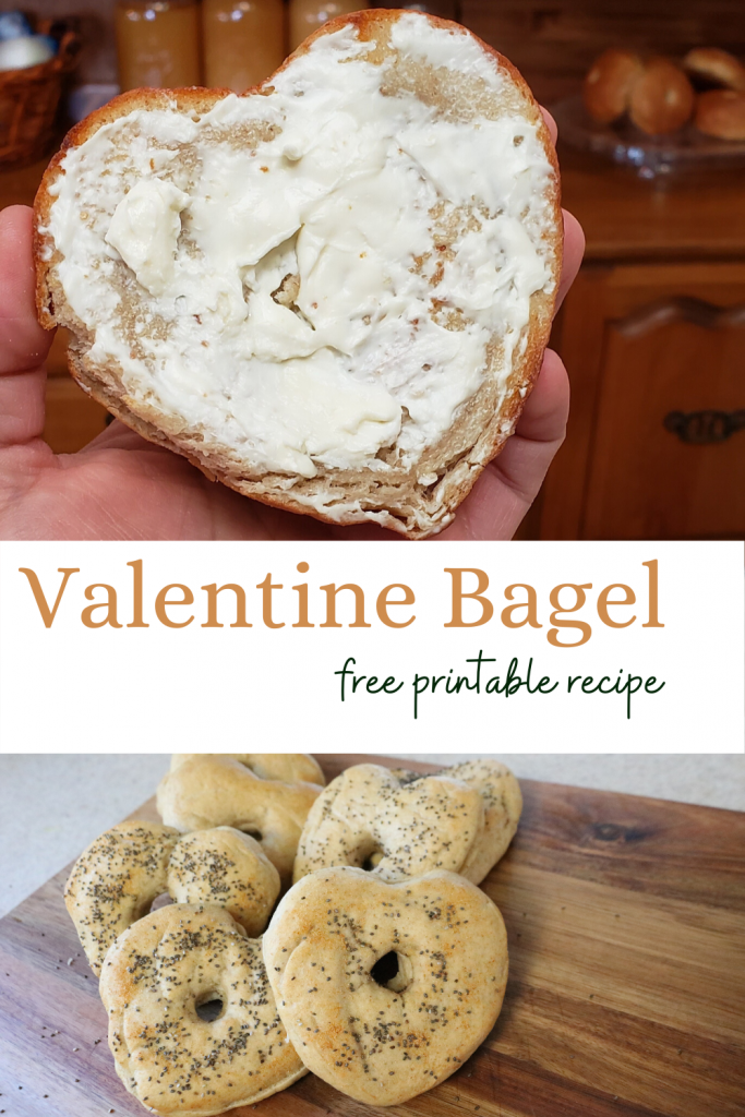 heart shaped bagel cut in half and spread with cream cheese. and 7 valentine bagels on a wooden cutting board