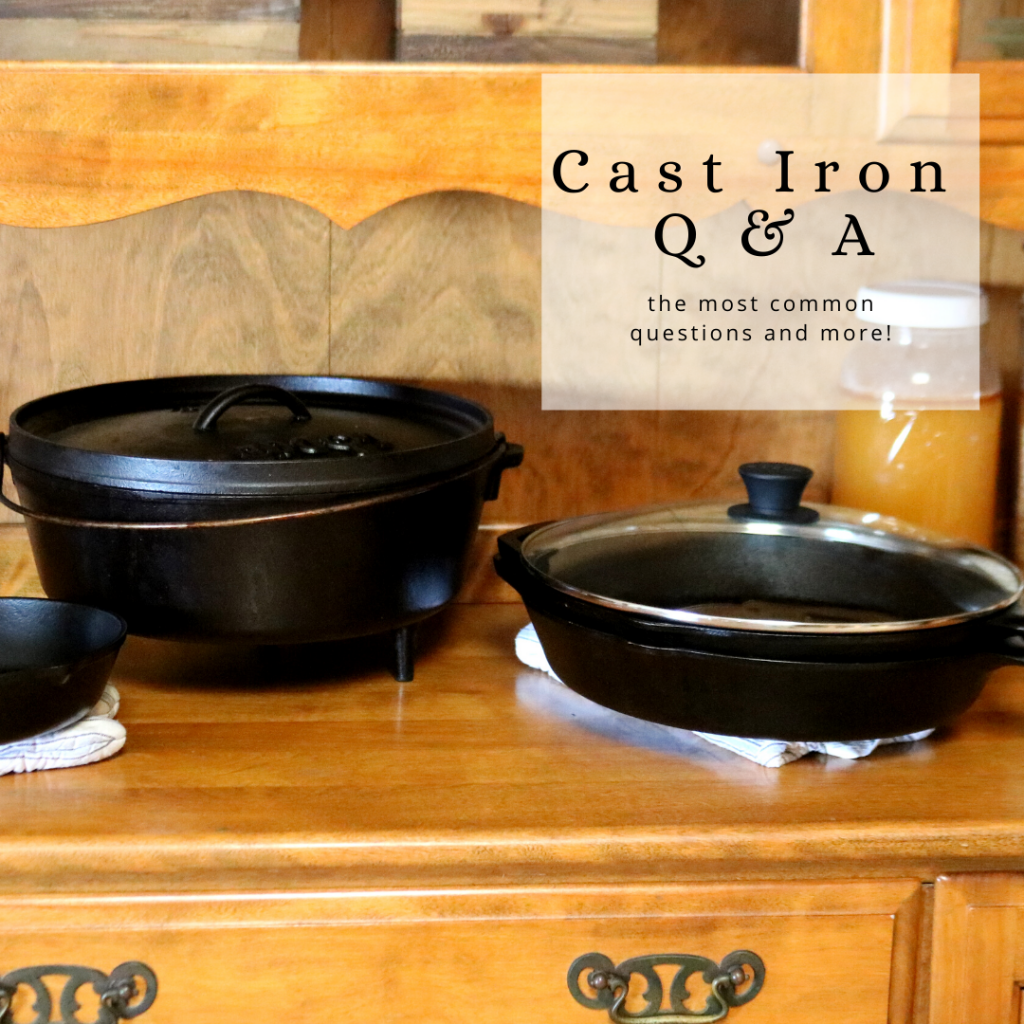 cast iron dutch oven sitting on a vintage hutch next to two 12 inch cast iron pans with a glass lid