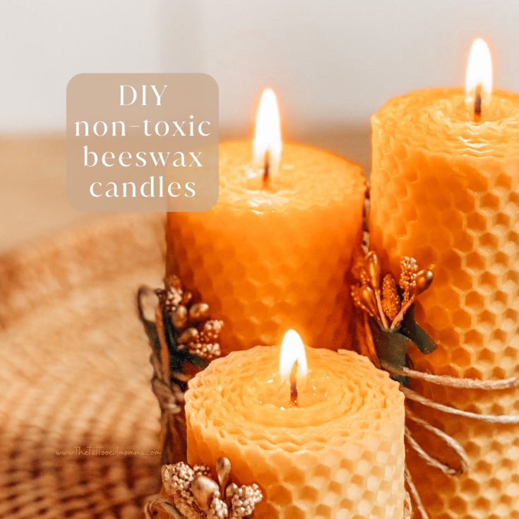 photo of 3 orangey-yellow candles makde from beeswax and molded to look like honey comb.
